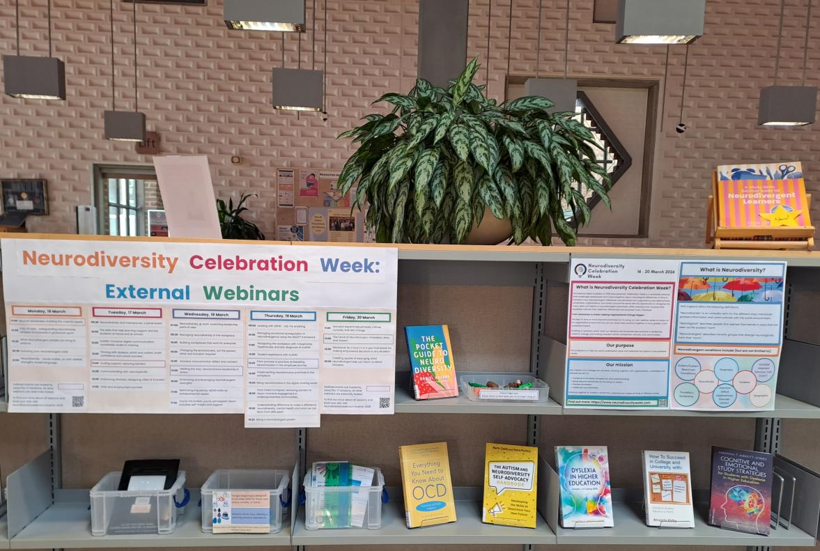 A library display of books and assistive resources associated with Neurodiversity Celebration Week